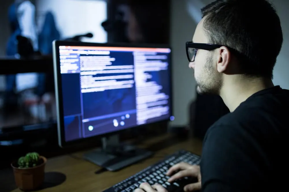 Dark web concept illustrating narcotics distribution with a hacker attacking a server a focus for law enforcement